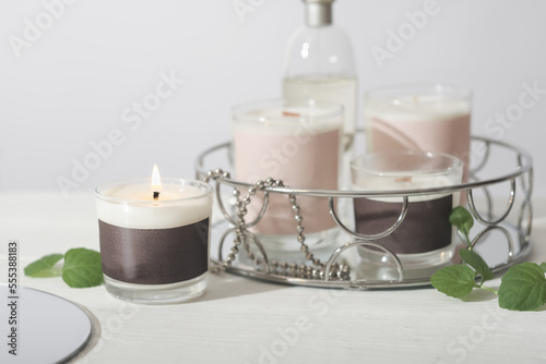 set of various aroma candles in glass jars. Scented handmade candle. burning soy candles. Aromatherapy and decor for home.