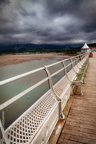Looking down Bangor pier at the intricate Victorian ironworks and octagonal booth,, Bangor, North Wales