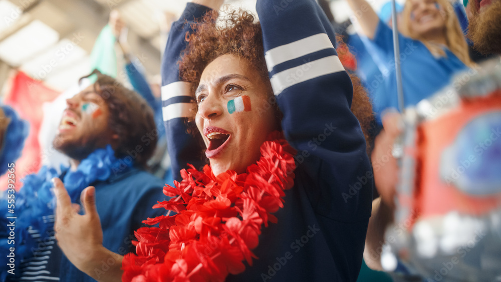 Sport Stadium Soccer Match: Portrait of Beautiful Bi Racial Fan Girl with Italian Flag Painted Face Cheering Team to Win, Beating Tambourine. Crowd Celebrate Goal, Championship Victory Sport Stadium Soccer Match: Portrait of Beautiful Bi Racial Fan Girl with Italian Flag Painted Face Cheering Team to Win, Beating Tambourine. Crowd Celebrate Goal, Championship Victory