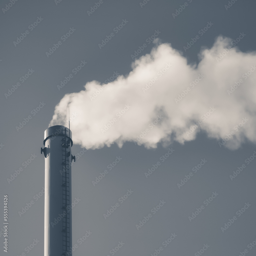 Factory chimney with smoke. Industrial pipe. Blue sky at sunny day. Air pollution. Black and white. Factory chimney with smoke. Industrial pipe. Blue sky at sunny day. Air pollution. Black and white.