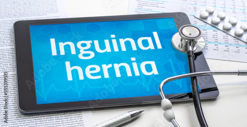 The word Inguinal hernia on the display of a tablet photo