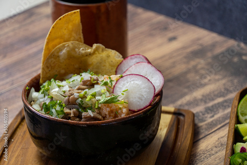 includes tatemada hot sauce, bacon, onion and cilantro on top, traditional mexican food photo