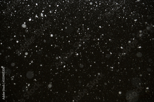 falling snow in the night sky