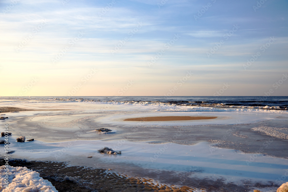 Winter view on the icy sea coast and beautiful calm sky, selective focus Winter view on the icy sea coast and beautiful calm sky, selective focus