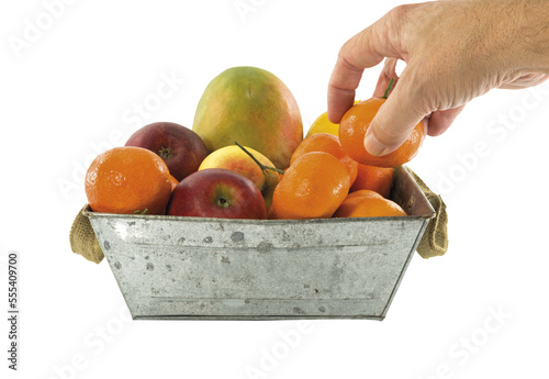 taking tangering from fruit bowl