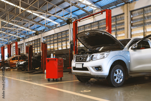 car repair in garage service station with soft-focus and over light in the background