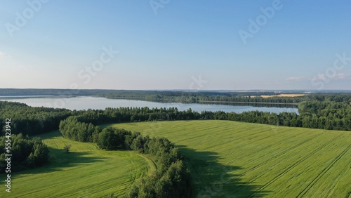 Krylovo, Minsk region, Belarus - 02.09.2022: Krylovo reservoir, bird's-eye view. Krylovo, Belarus. Minsk water system. A picturesque lake near a dense forest. Green summer outside the city