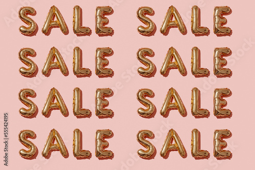 repeated word sale on a pinkg background