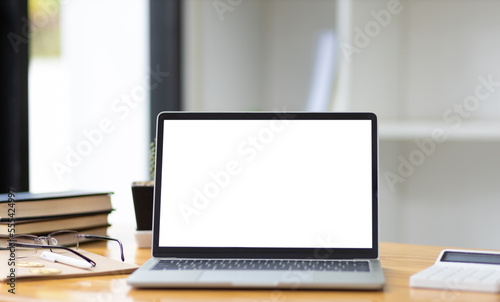 Fototapeta Naklejka Na Ścianę i Meble -  Laptop in office with blank screen with workspace.