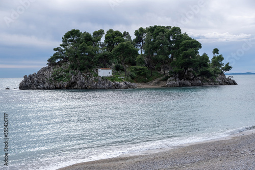 Greece Parga. Panagia island off the coast of Parga, small chapel and trees on the rock