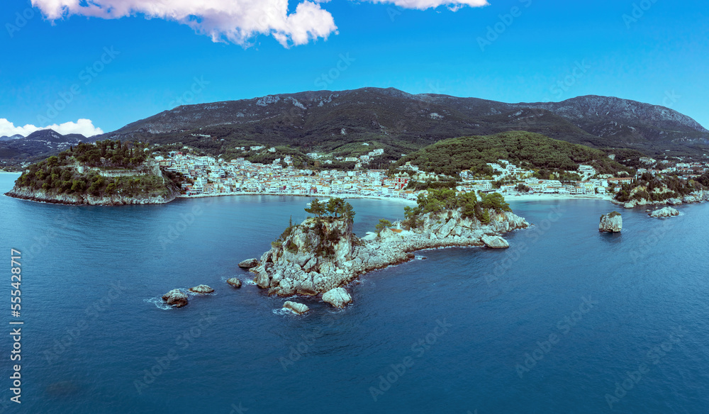 Parga Greece Epirus. Aerial drone view of coastal city Panagia islet blue afternoon sky background.