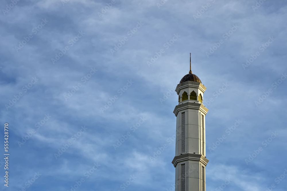 Great Mujahidin mosque minaret against a blue sky background