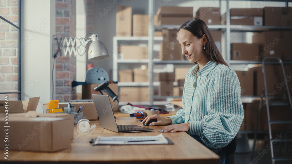 Online Store Inventory Manager Using Laptop Computer, Preparing a Small Parcel for Postage. Young Confident Small Business Owner Working in Storeroom, Preparing Order for Client.