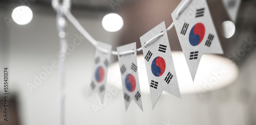 A garland of South Korean national flags on an abstract blurred background