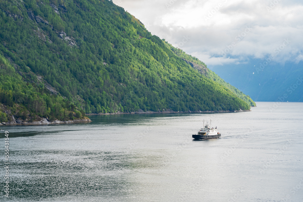 Beautiful fjord landscape with a ship at Hellesylt in Norway