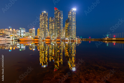 Busan city skyline and skyscraper at Haeundae district with yacht pier at Busan, South Korea, Busan, South Korea city skyline in the Haeundae district.