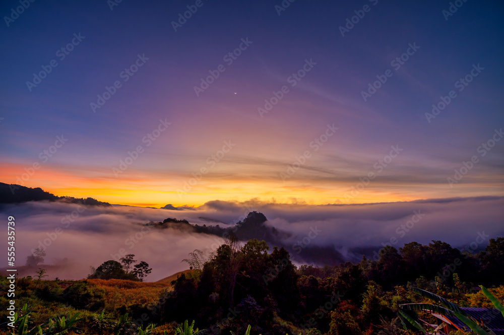 Fototapeta premium Jabo view point with fog and twilight in morning at Jabo village, Mae Hong Son, Thailand