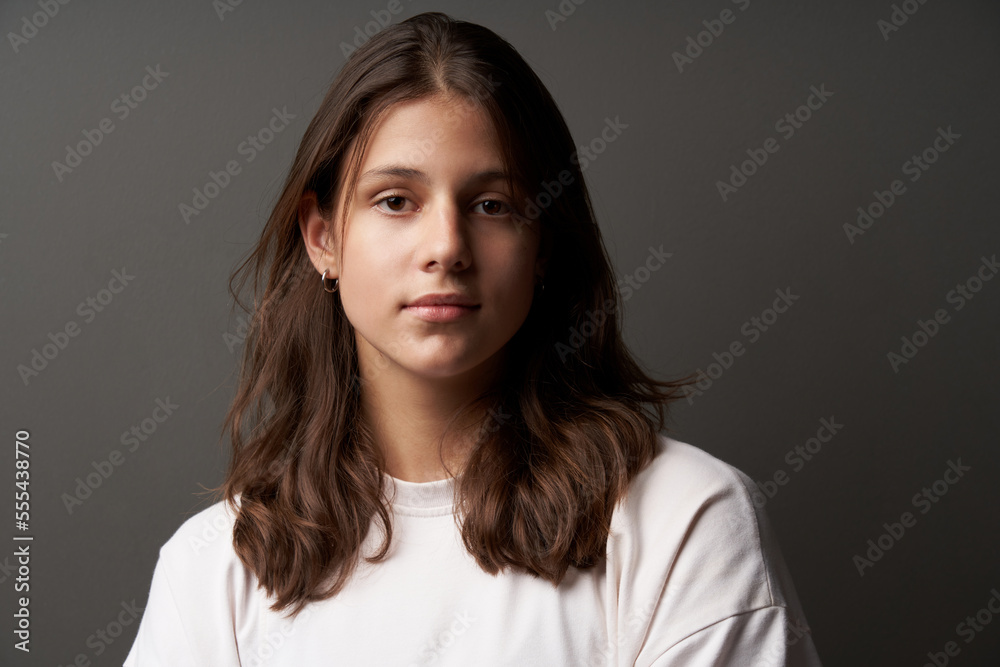 Fototapeta premium Closeup portrait of casual natural girl looking calm and confident