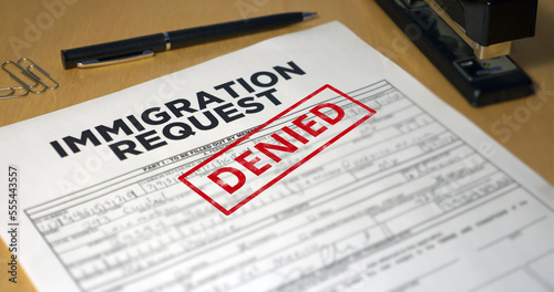 A closeup view of an immigration application getting denied. Data on form is fictional.	