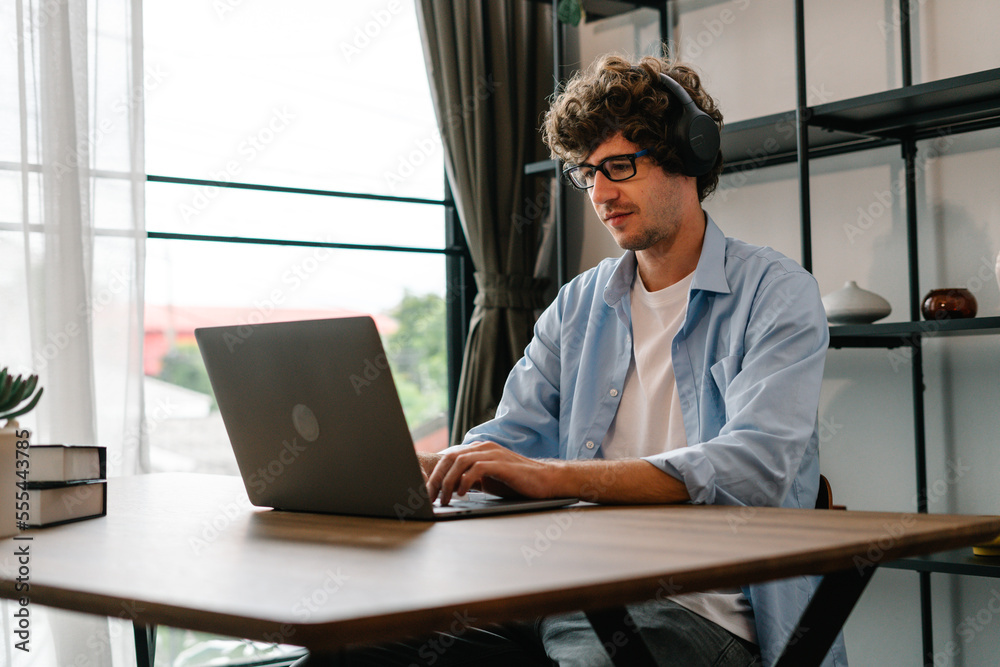 Profession manager online working in office, Smart Businessman planning, thinking and working with laptop computer at his desk in workspace Profession manager online working in office, Smart Businessman planning, thinking and working with laptop computer at his desk in workspace