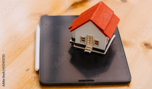 Wallpaper Mural Discussion with a real estate agent, House model with agent and customer discussing for the contract to buy, get insurance or loan real estate or property. Torontodigital.ca