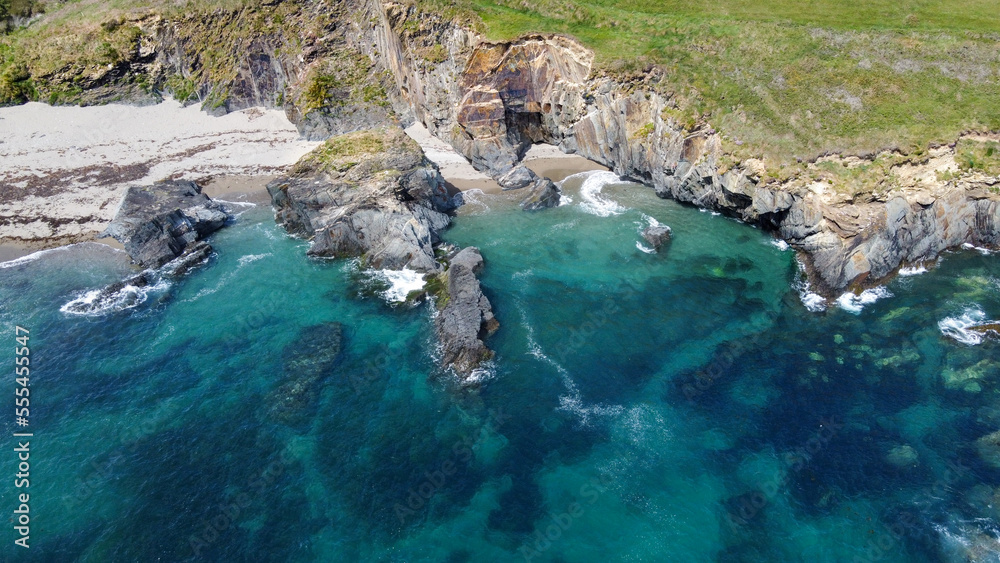Rocky shores along the route of the Wild Atlantic Way, top view. Seascape of the southern coast of Ireland. Beautiful rocky slopes. Rocky shores along the route of the Wild Atlantic Way, top view. Seascape of the southern coast of Ireland. Beautiful rocky slopes.