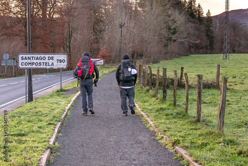 Way of St. James. Two pilgrims starting the Roncesvalles-Zubiri stage