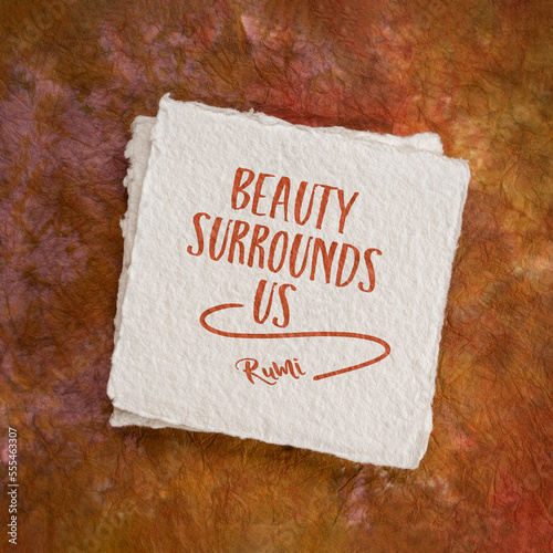 Beauty surrounds us. Inspirational quote from Rumi, 13th-century Persian poet. photo