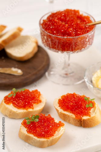 Sandwiches with red caviar on a baguette