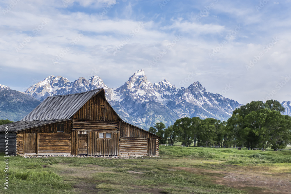 John Moulton Barn and the rugged peaks of the Teton Range, Grand Teton National Park; Wyoming, United States of America John Moulton Barn and the rugged peaks of the Teton Range, Grand Teton National Park; Wyoming, United States of America