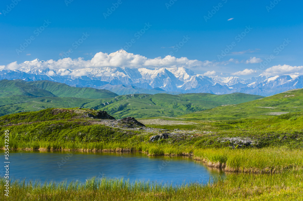 20,320' Mount Denali (previously named Mount McKinley) on a sunny, summer day as seen from Peters Hills in Denali State Park in South-central Alaska; Alaska, United States of America 20,320' Mount Denali (previously named Mount McKinley) on a sunny, summer day as seen from Peters Hills in Denali State Park in South-central Alaska; Alaska, United States of America