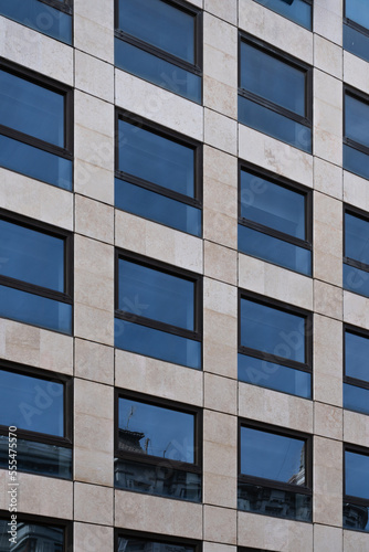 Perspective of a modern building facade with windows creating a pattern