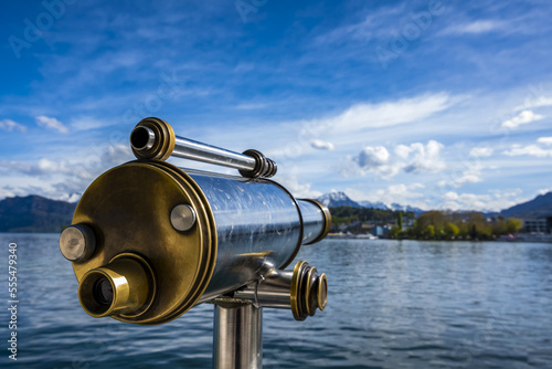 Binoculars looking out to water of Lake Lucerne and shoreline; Lucerne, Lucerne, Switzerland photo