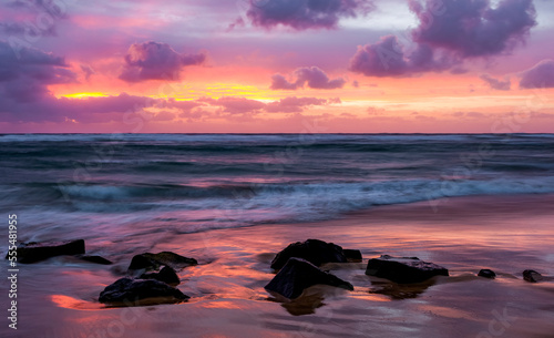 Sunrise over the Pacific ocean, viewed from Lydgate beach; Kapaa, Kauai, Hawaii, United States of America photo