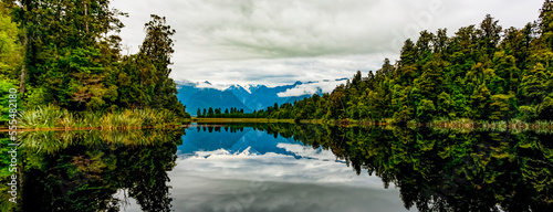 Mirror image of landscape into Lake Matheson; South Island, New Zealand