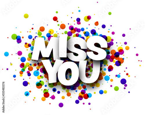 Miss you sign over colorful round confetti background.