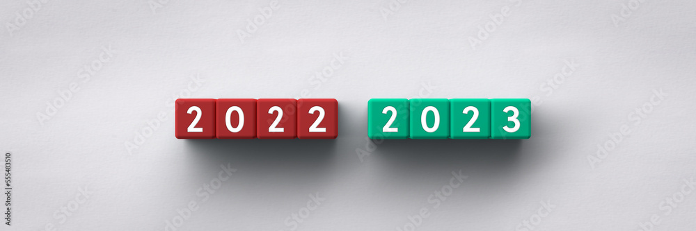 3D Cubes with the years 2022-2023 on a paper background 3D Cubes with the years 2022-2023 on a paper background