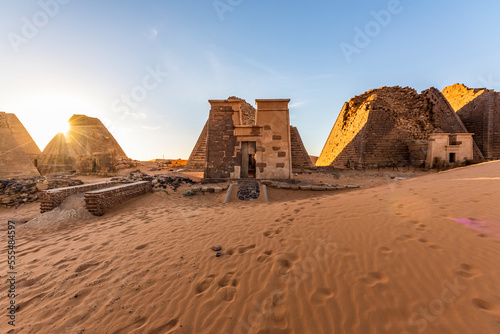 Pyramids and reconstructed chapel in the Northern Cemetery at Begarawiyah, Meroe, Sudan photo