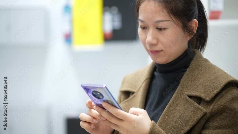 young female using mobile phone young female using mobile phone