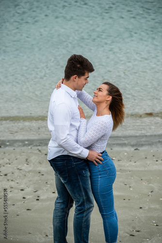 Portrait of a young couple showing affection; Wellington, North Island, New Zealand photo