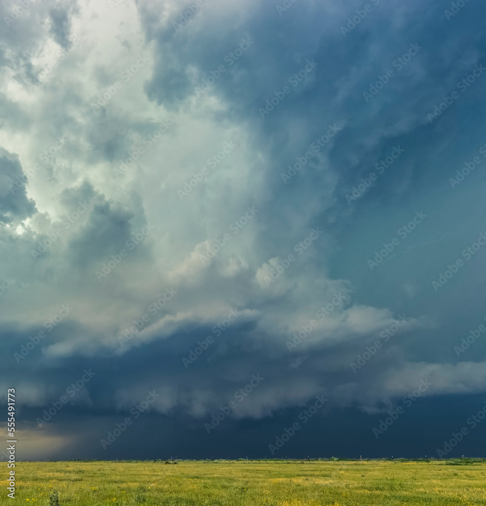 An enormous thunderstorm updraft erupts above the high plains of the Texas Panhandle; Texas, United States of America An enormous thunderstorm updraft erupts above the high plains of the Texas Panhandle; Texas, United States of America