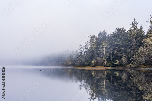 Fog begins to lift from a peaceful scene at Fort Stevens State Park on the Oregon Coast; Hammond, Oregon, United States of America photo