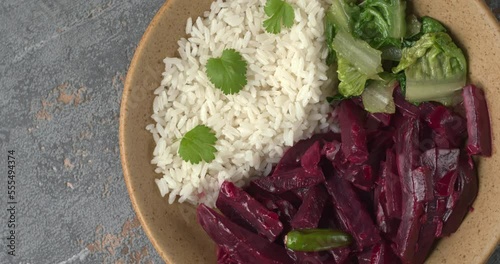 Top view of beetroot curry with sona masoori rice and stir-fried lettuce. Table spin. photo