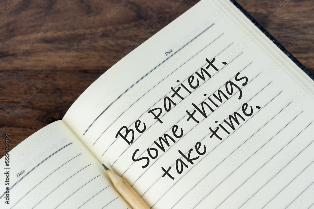 Inspirational quotes on note pad with text - Be patient, some things take time. Inspirational quotes on note pad with text - Be patient, some things take time.