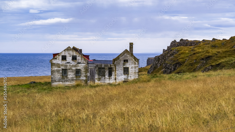 A weathered and abandoned house along the coast; Iceland A weathered and abandoned house along the coast; Iceland