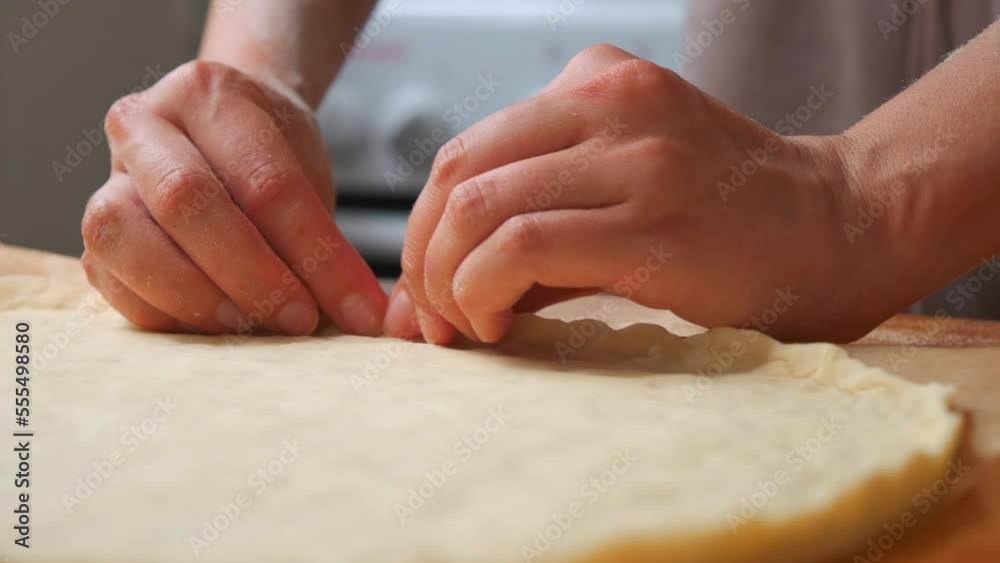 chef makes pizza. traditional Italian pizza margarita. the chef distributes the pizza base from tomatoes, basil, garlic, onion and cheese on the dough chef makes pizza. traditional Italian pizza margarita. the chef distributes the pizza base from tomatoes, basil, garlic, onion and cheese on the dough