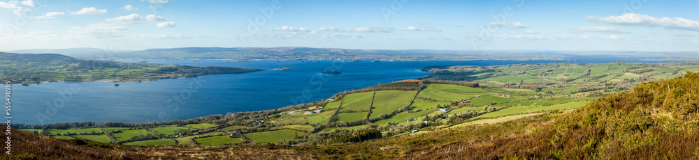 Panoramic view of Lough Derg and the surrounding countryside from the Tipperary side of the lake on a clear sunny day; Tautinna, County Tipperary, Ireland Panoramic view of Lough Derg and the surrounding countryside from the Tipperary side of the lake on a clear sunny day; Tautinna, County Tipperary, Ireland