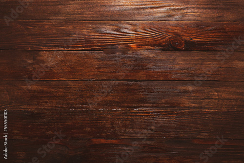 Vintage brown wood background texture with knots and nail holes. Old painted wood wall. Brown abstract background. Vintage wooden dark horizontal boards.