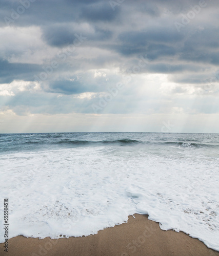 Waves at Beach with Sunrays through Clouds, Point Pleasant, New Jersey, USA photo