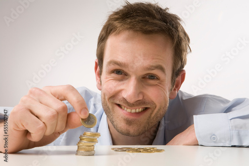 Man Counting Coins photo